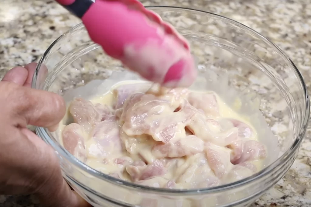 Coating the chicken thighs 